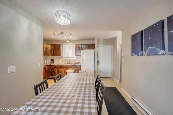 a view of a kitchen from the hallway