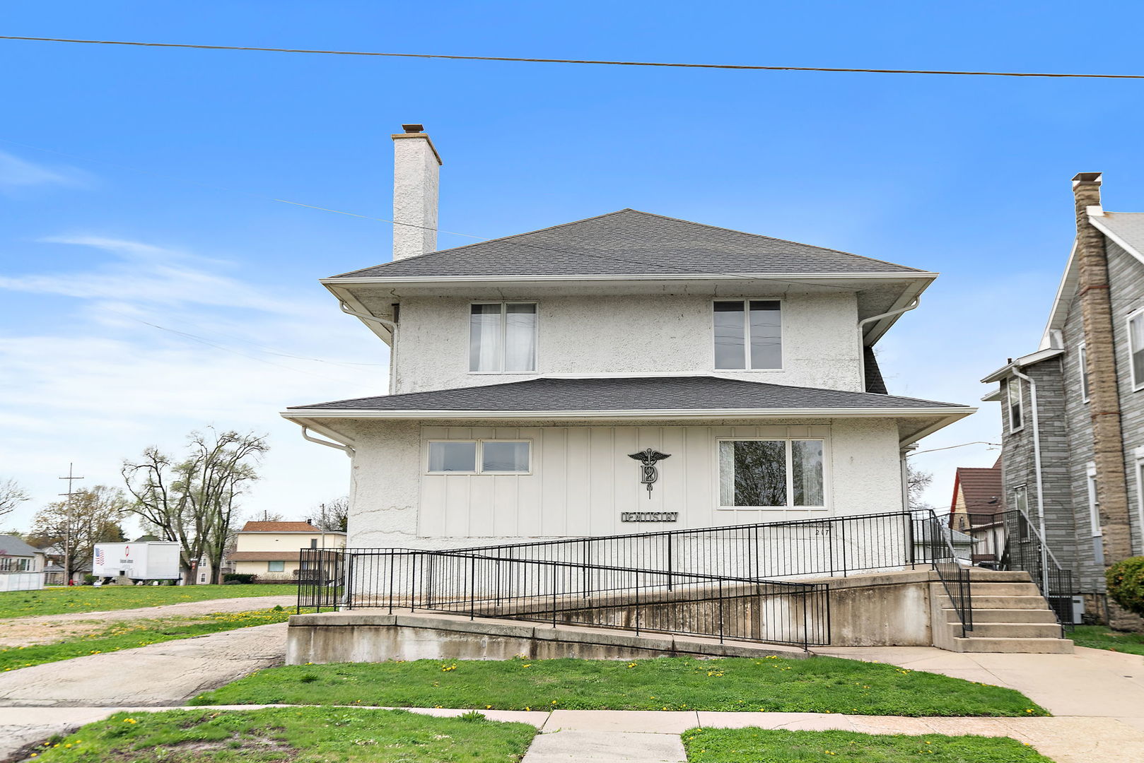 217 South 3rd Street DeKalb, IL 60115 - Photo 1 of 20 a view of a white house with a yard