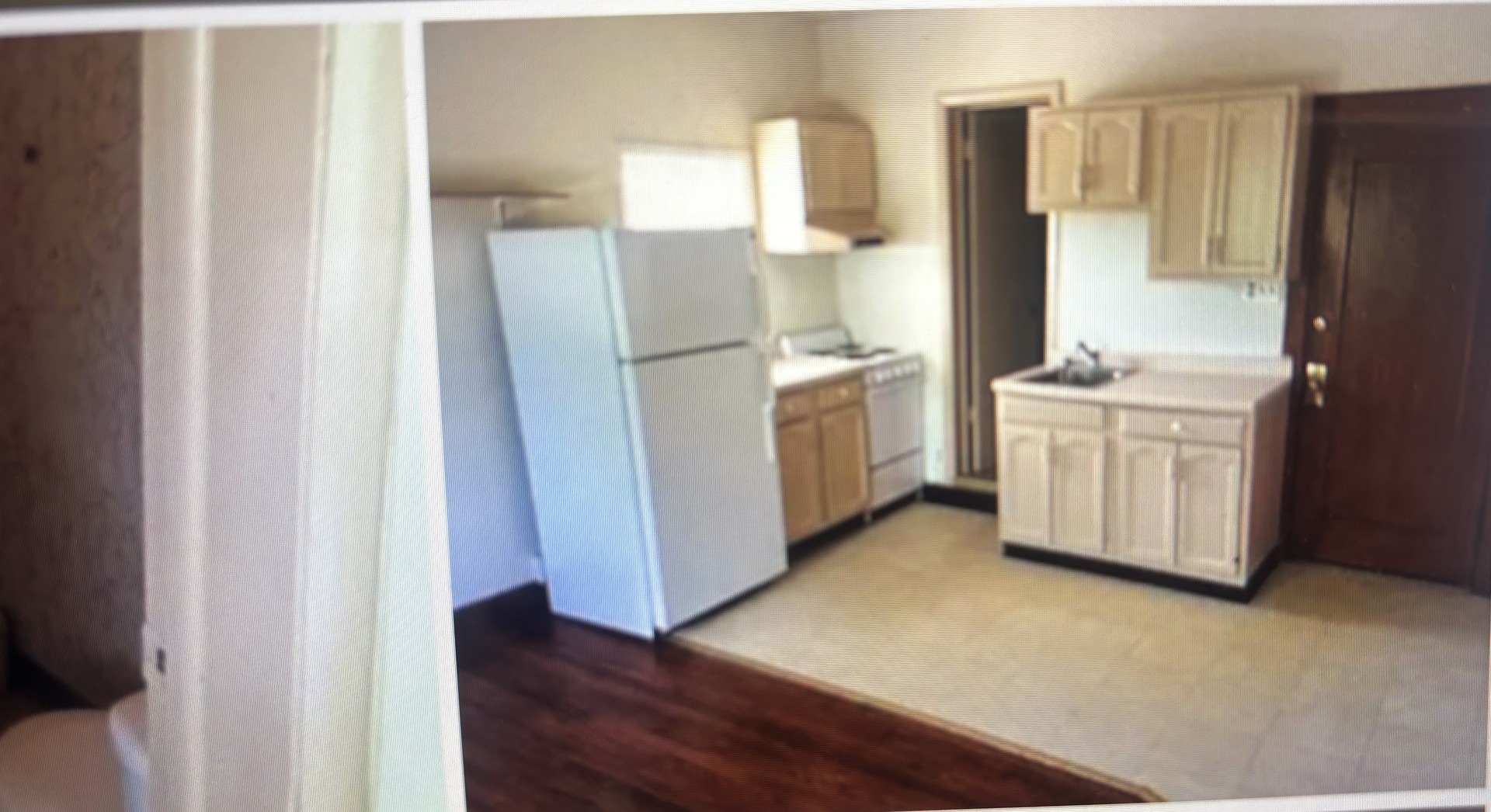 217 South 3rd Street DeKalb, IL 60115 - Photo 12 of 20 a kitchen with a refrigerator sink and stove