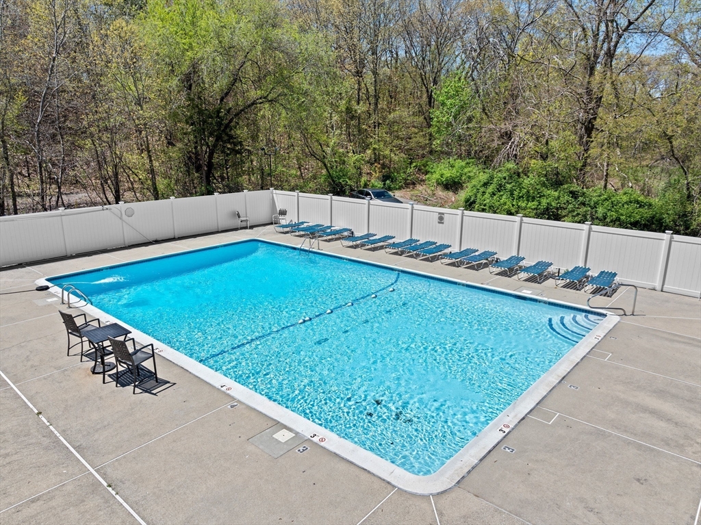 4 Beal's Cove Road, Unit B Hingham, MA 02043 - Photo 13 of 16 a view of a backyard with chairs