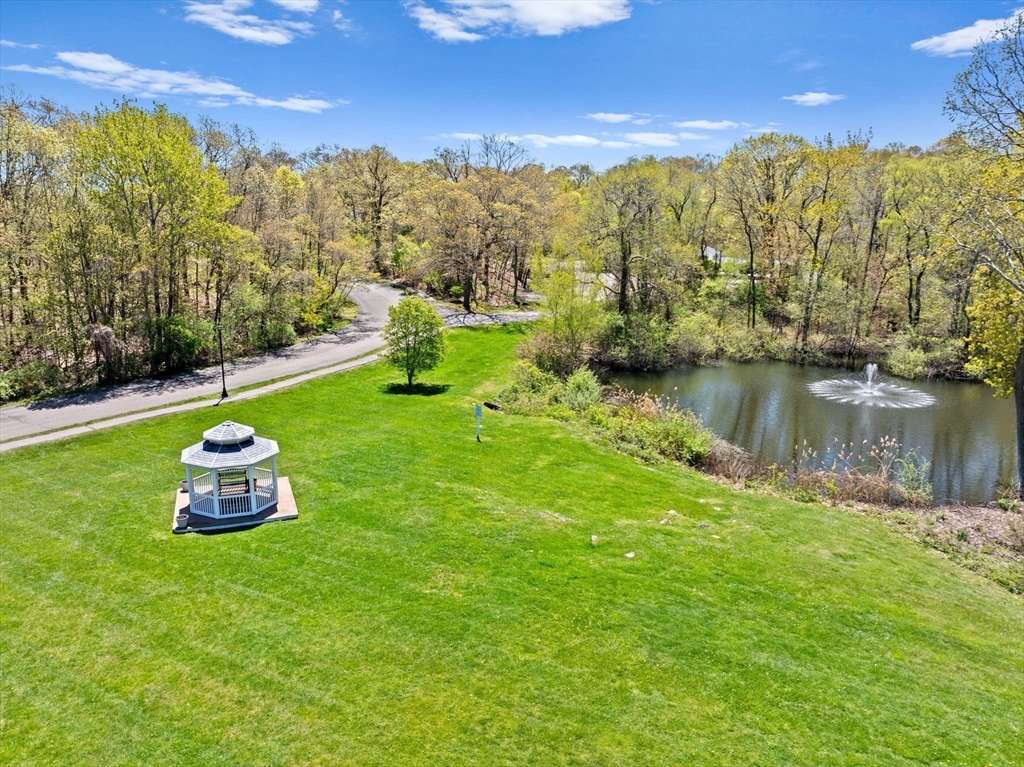 4 Beal's Cove Road, Unit B Hingham, MA 02043 - Photo 15 of 16 a large body of water with a mountain in the background