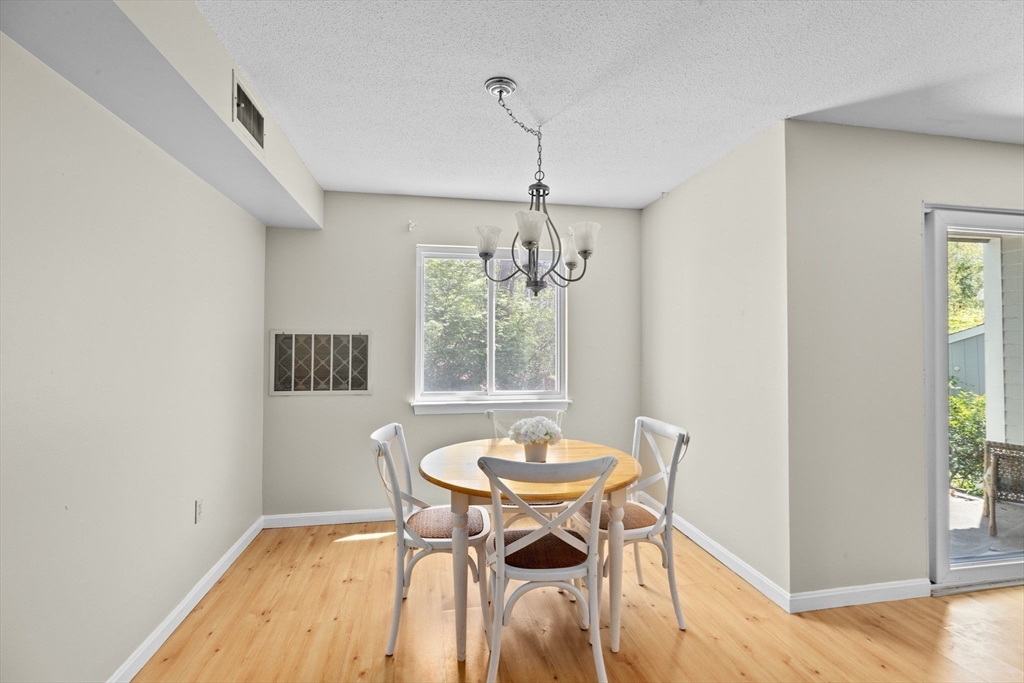 4 Beal's Cove Road, Unit B Hingham, MA 02043 - Photo 2 of 16 a dining room with furniture and window