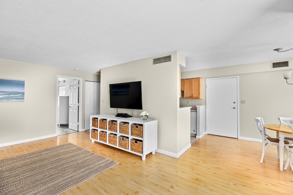 4 Beal's Cove Road, Unit B Hingham, MA 02043 - Photo 6 of 16 a room with furniture and flat screen tv