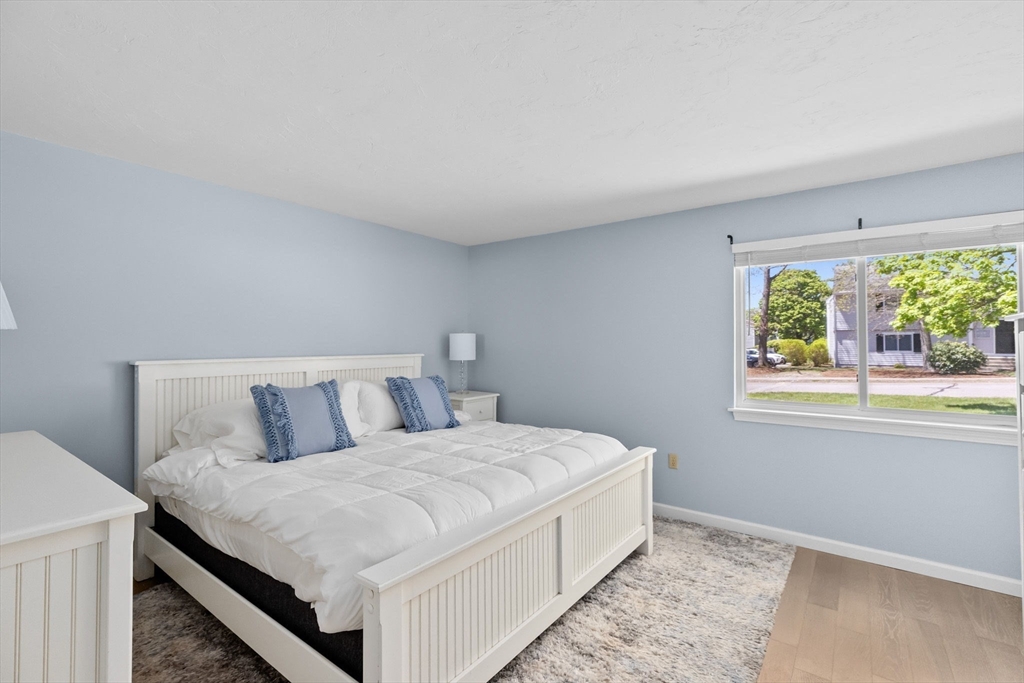 4 Beal's Cove Road, Unit B Hingham, MA 02043 - Photo 8 of 16 a bed room with a bed and a window