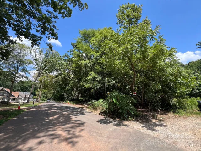 a view of street with parked cars