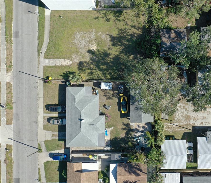 1744 10th Street Sarasota, FL 34236 - Photo 7 of 32 an aerial view of residential houses with outdoor space and parking