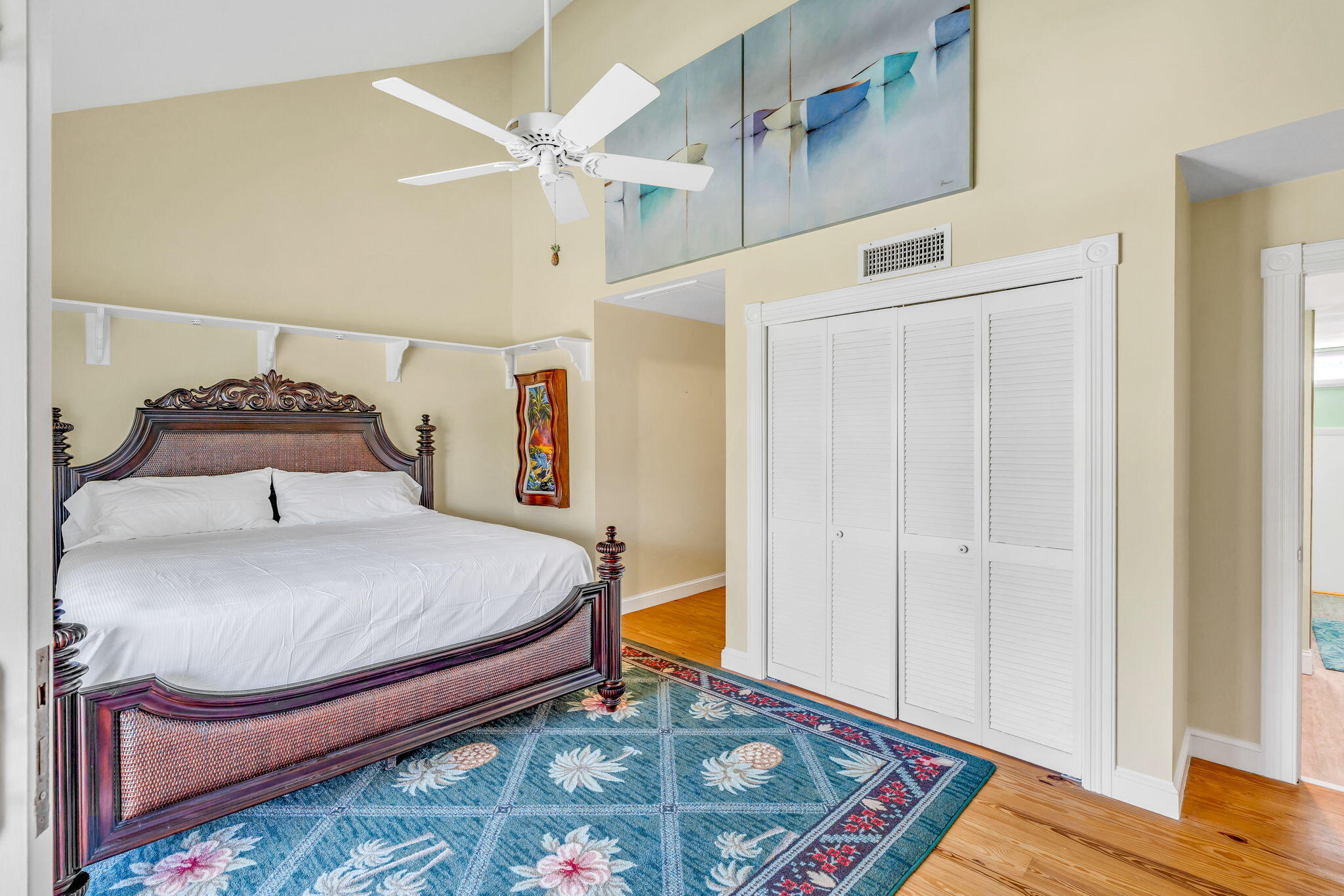 3365 Flagler Avenue Key West, FL 33040 - Photo 17 of 37 a bedroom with a bed and wooden floor