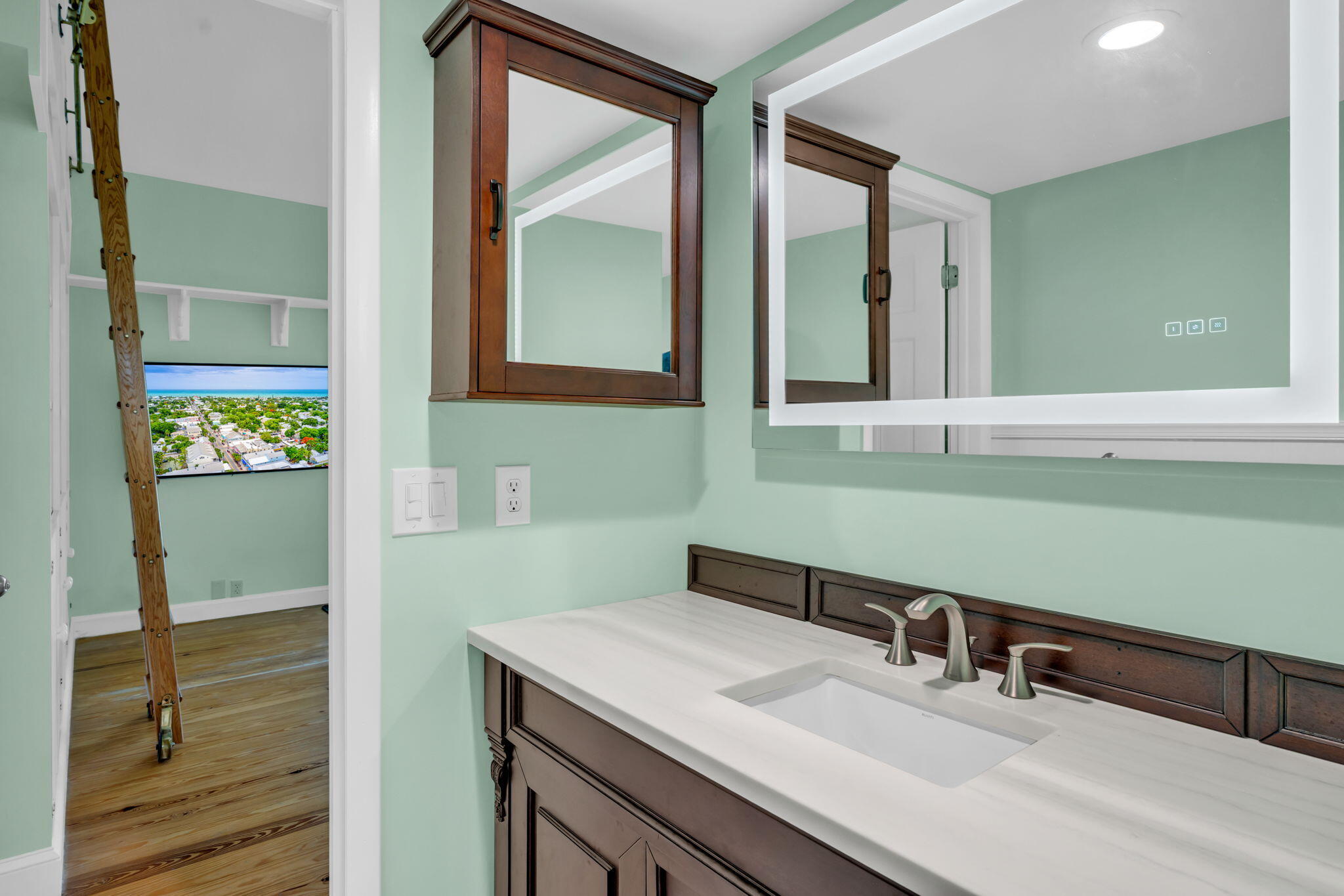 3365 Flagler Avenue Key West, FL 33040 - Photo 19 of 37 a bathroom with a sink and a mirror