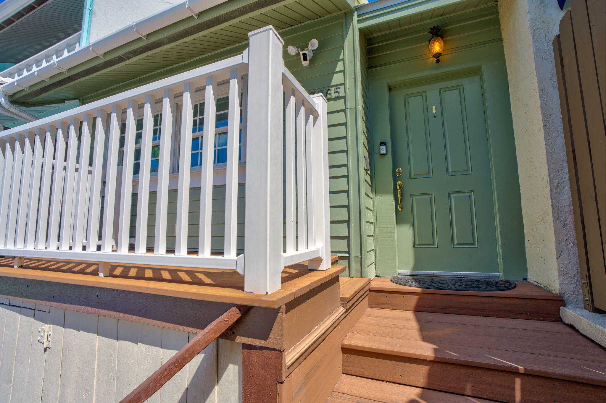 3365 Flagler Avenue Key West, FL 33040 - Photo 29 of 37 a view of a balcony with wooden floor and stairs