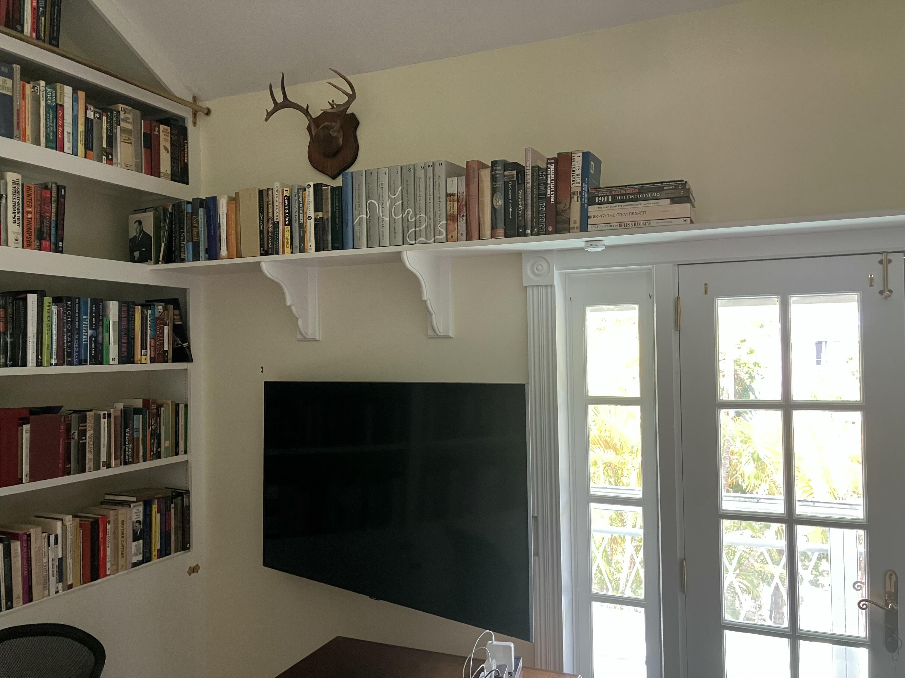 3365 Flagler Avenue Key West, FL 33040 - Photo 33 of 37 a view of a living room with furniture and a book shelf