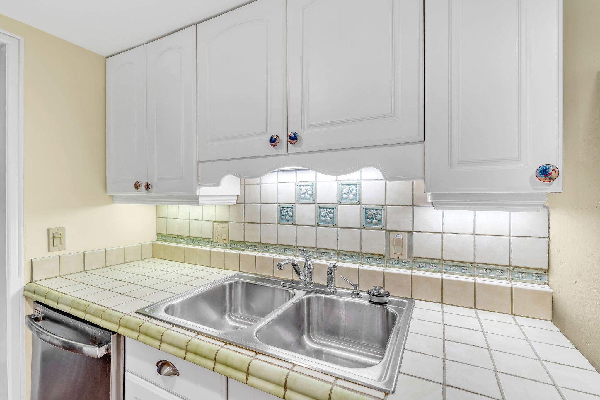 3365 Flagler Avenue Key West, FL 33040 - Photo 6 of 37 a kitchen with granite countertop white cabinets and sink