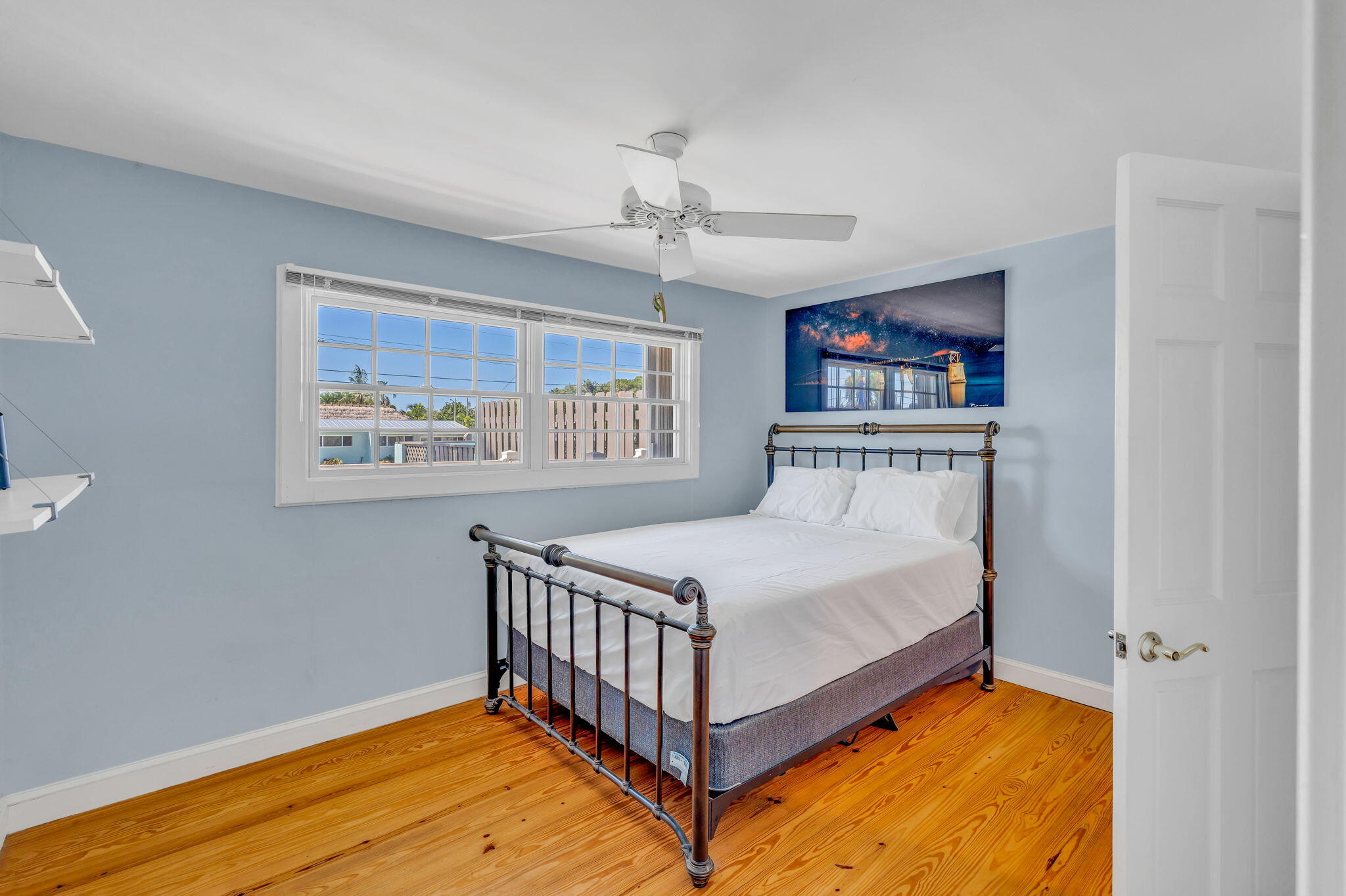 3365 Flagler Avenue Key West, FL 33040 - Photo 10 of 37 a bedroom with bed and wooden floor