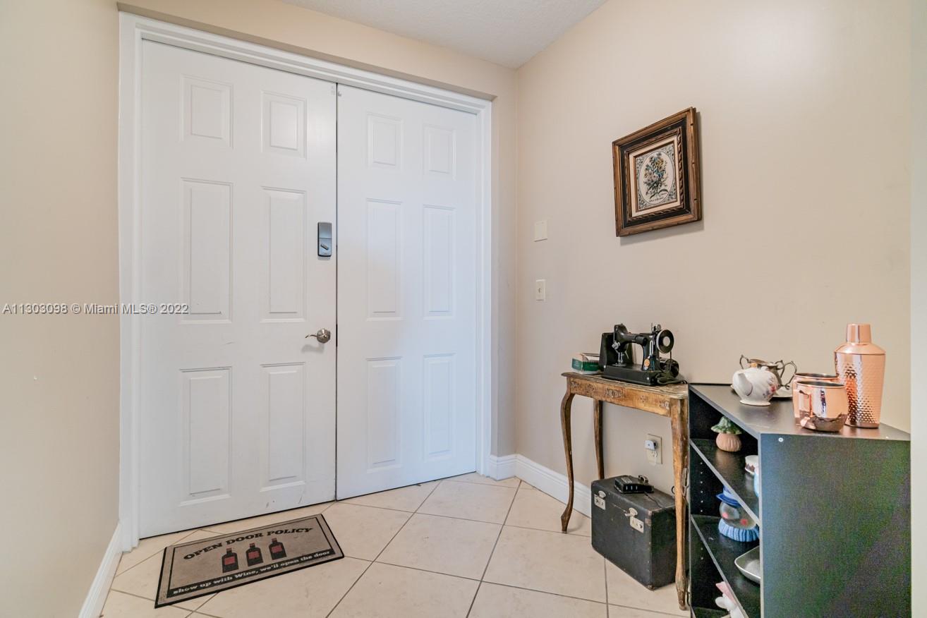 3210 Northeast 5th Street, Unit 203 Pompano Beach, FL 33062 - Photo 12 of 34 a view of a workspace with furniture