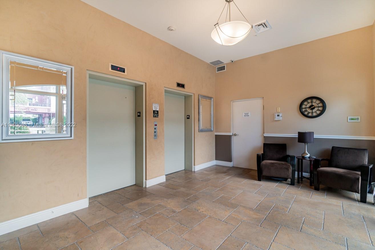 3210 Northeast 5th Street, Unit 203 Pompano Beach, FL 33062 - Photo 14 of 34 a view of a livingroom with furniture and a window