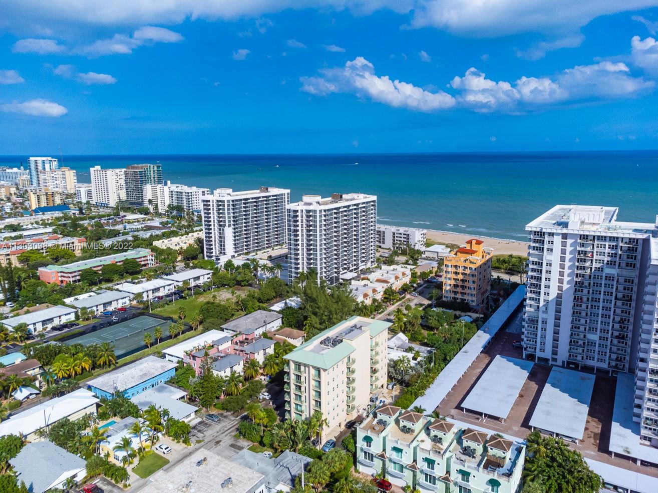 3210 Northeast 5th Street, Unit 203 Pompano Beach, FL 33062 - Photo 17 of 34 a view of a city with tall buildings