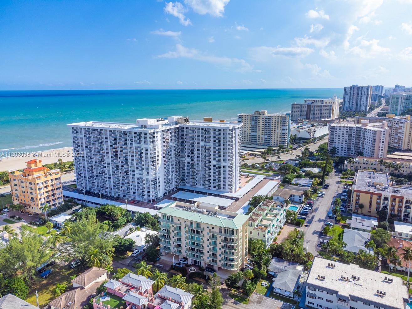 3210 Northeast 5th Street, Unit 203 Pompano Beach, FL 33062 - Photo 2 of 34 a view of a city with tall buildings