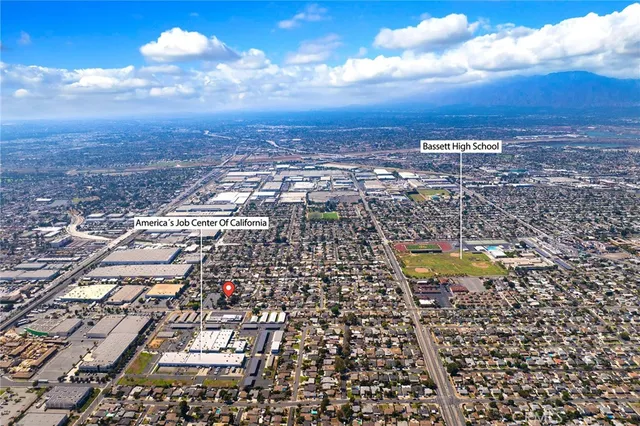 an aerial view of residential building and lake