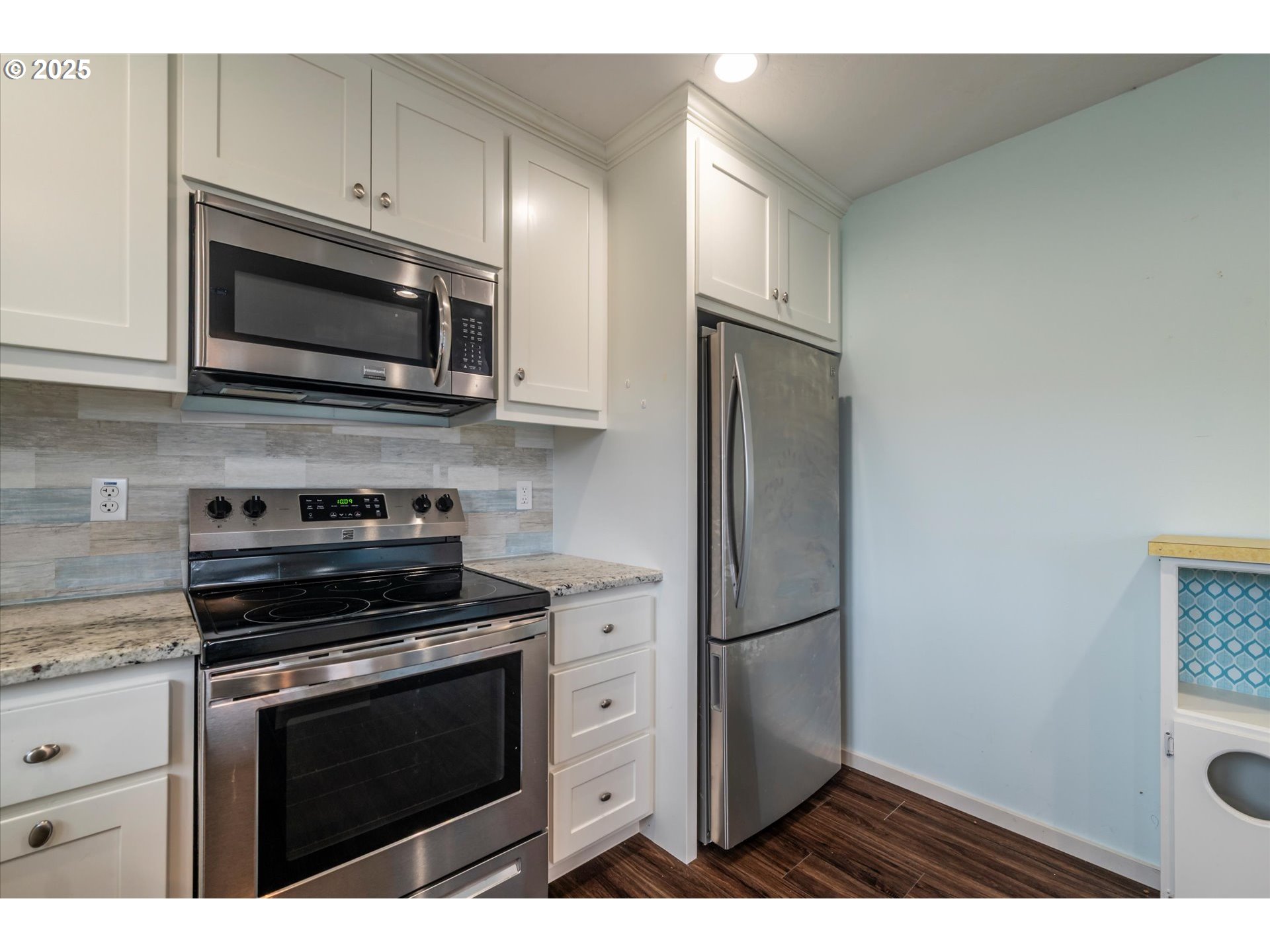 3145 Periwinkle Lane Southwest Bandon, OR 97411 - Photo 16 of 26 a kitchen with cabinets stainless steel appliances and a counter space