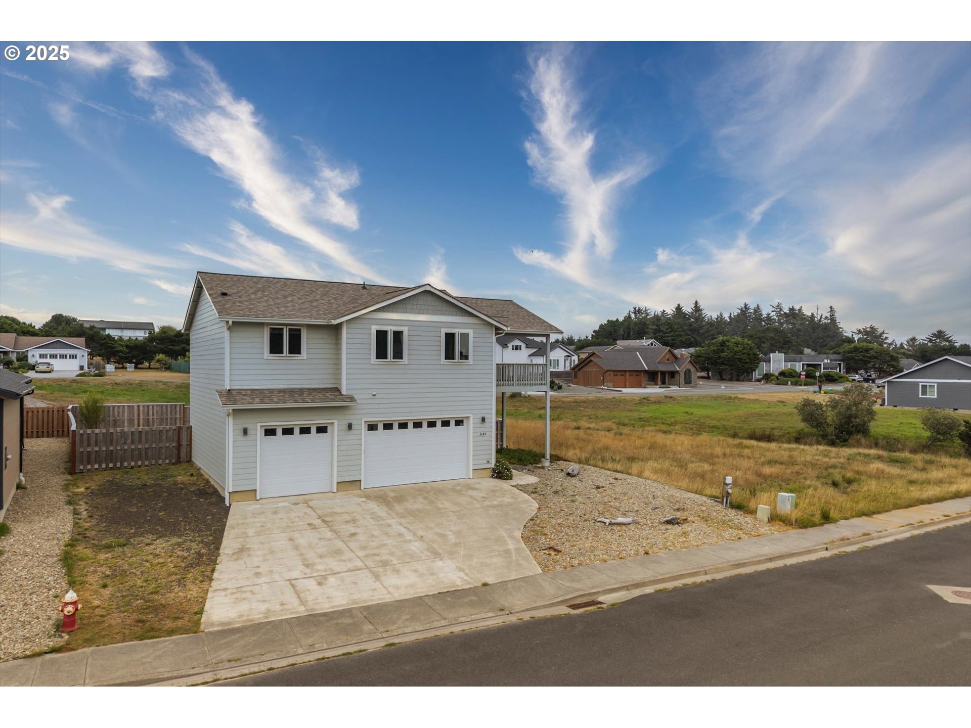3145 Periwinkle Lane Southwest Bandon, OR 97411 - Photo 2 of 26 a view of swimming pool with a yard and wooden fence