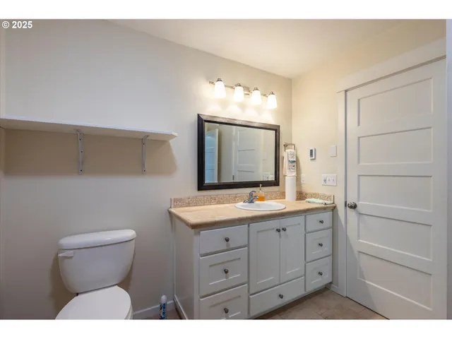 a view of an empty room and wooden floor