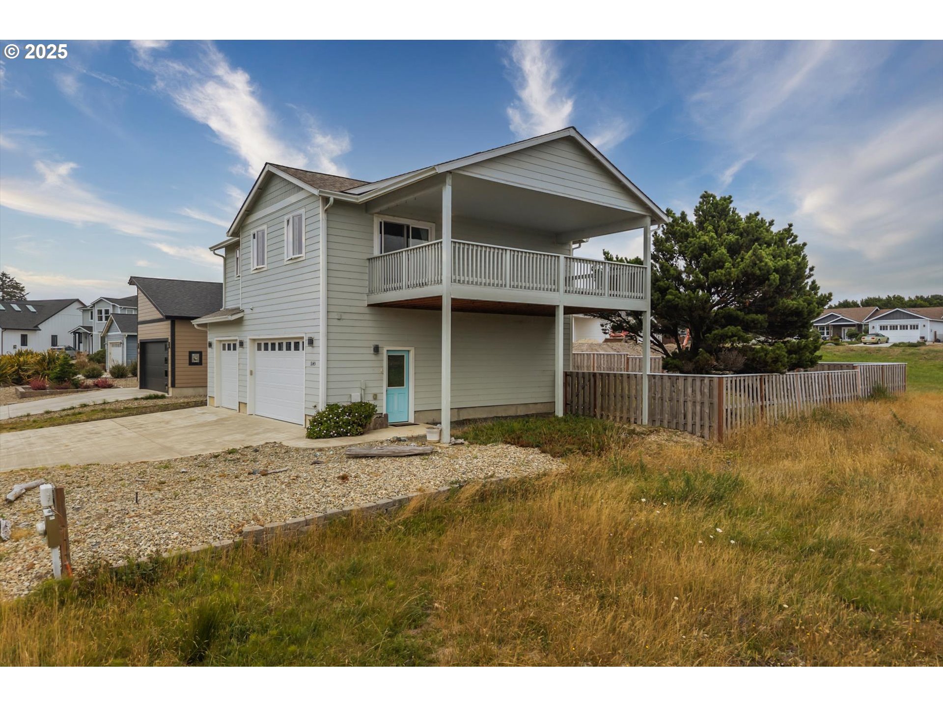 3145 Periwinkle Lane Southwest Bandon, OR 97411 - Photo 3 of 26 a house view with a outdoor space