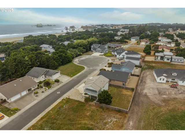 an aerial view of a house with outdoor space