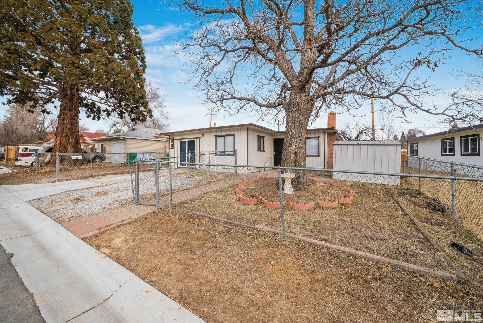 1680 Sterling Way Reno, NV 89512 - Photo 1 of 20 front view of a house with a yard