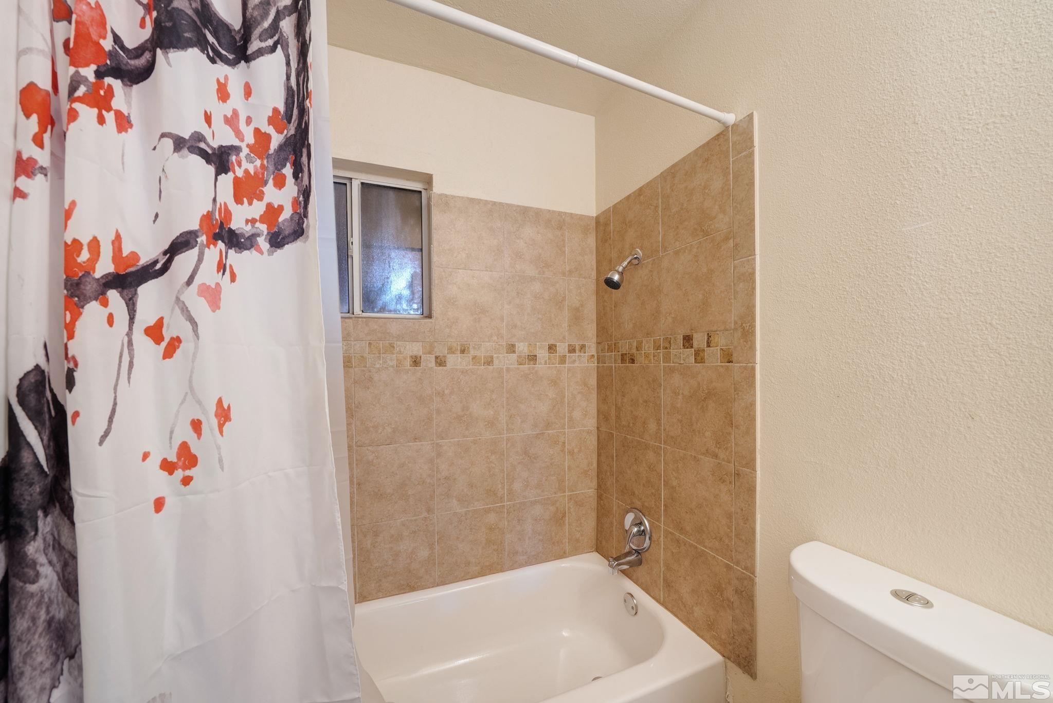 1680 Sterling Way Reno, NV 89512 - Photo 12 of 20 a bathroom with a shower and a toilet