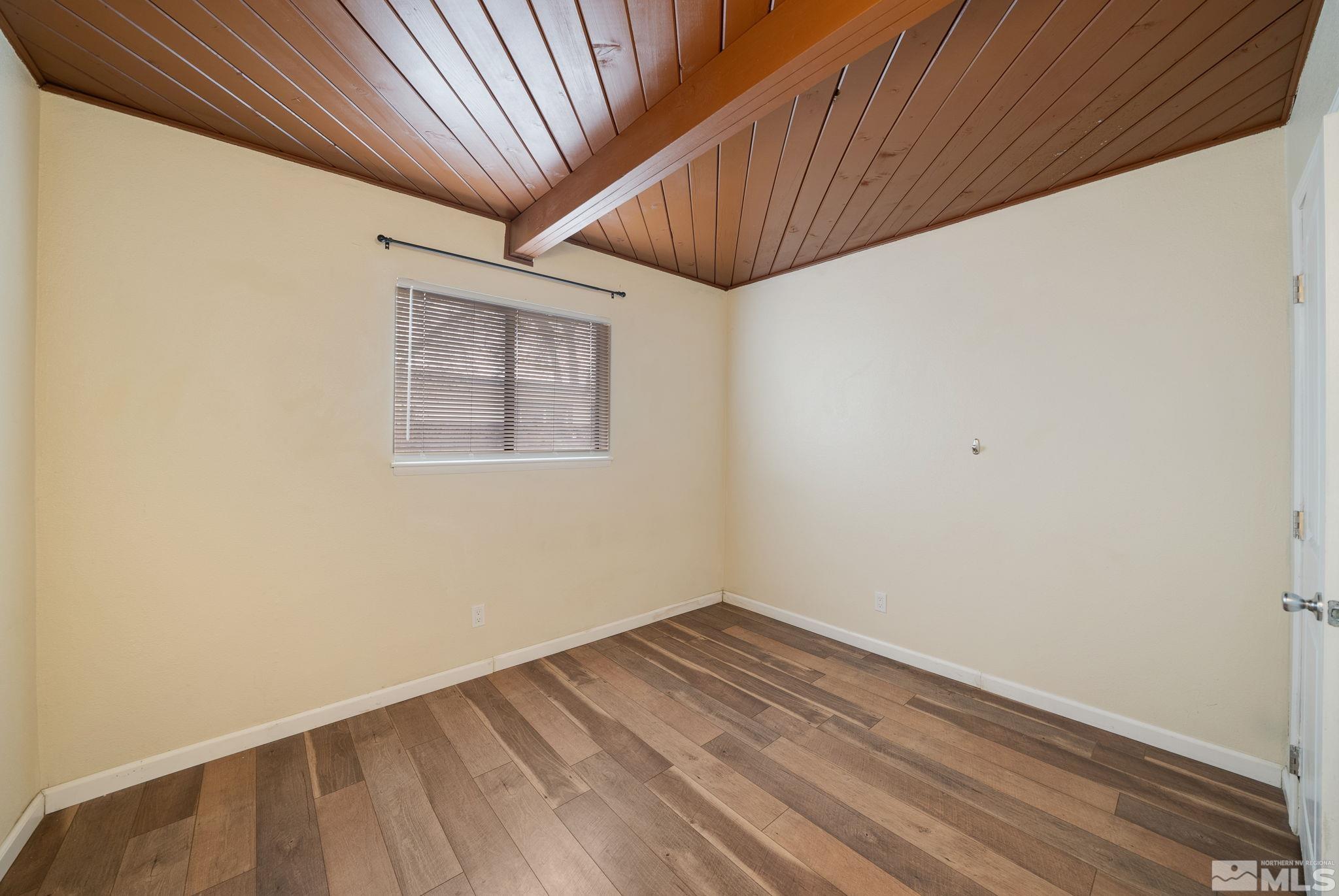 1680 Sterling Way Reno, NV 89512 - Photo 16 of 20 a view of empty room with wooden floor and fan