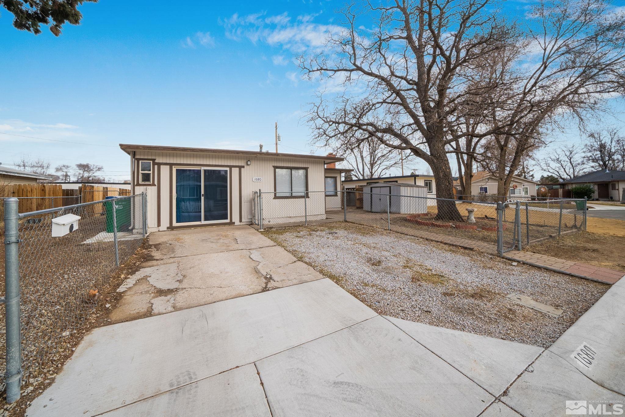 1680 Sterling Way Reno, NV 89512 - Photo 20 of 20 a backyard of a house with large trees