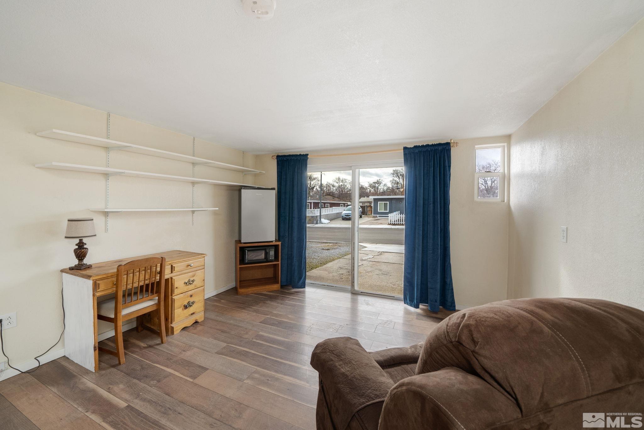 1680 Sterling Way Reno, NV 89512 - Photo 8 of 20 a living room with furniture and a wooden floor