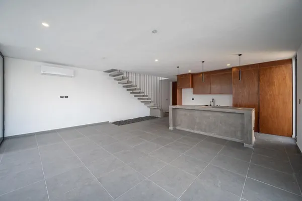 a view of kitchen and kitchen with stainless steel appliances wooden cabinets