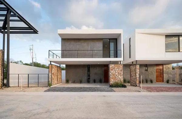 a front view of a house with a garage