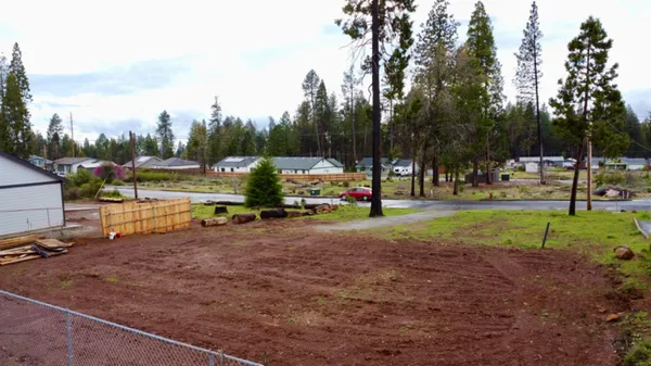a view of park with swings and slides