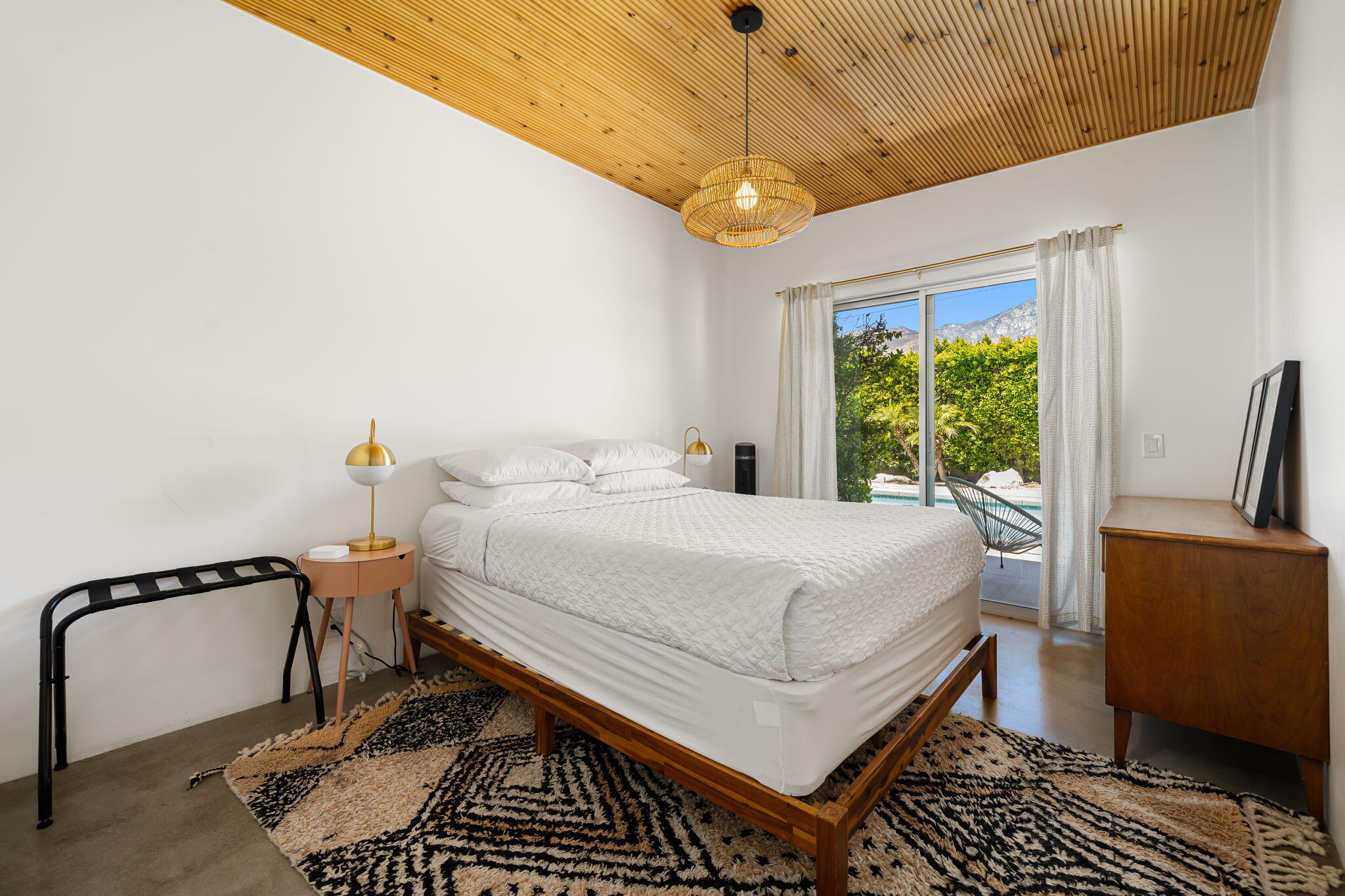 623 Desert Way Palm Springs, CA 92264 - Photo 16 of 39 a bedroom with a bed and a chandelier