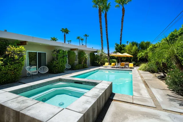 a view of a chairs and table in the patio