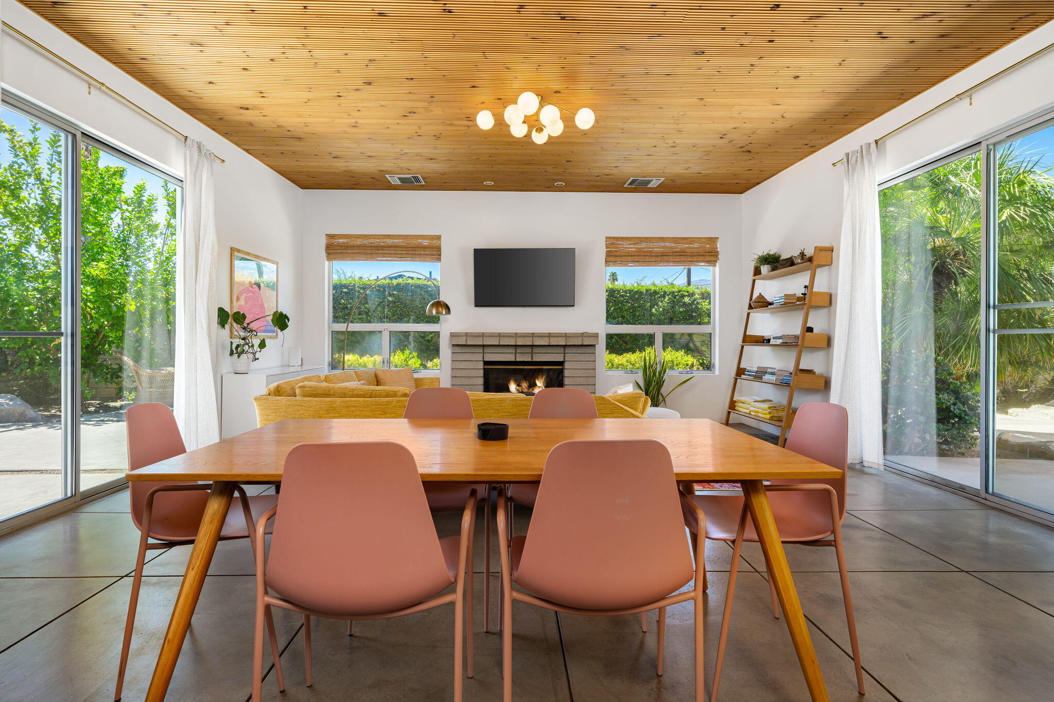 623 Desert Way Palm Springs, CA 92264 - Photo 2 of 39 a view of a dining room with furniture large windows and wooden floor