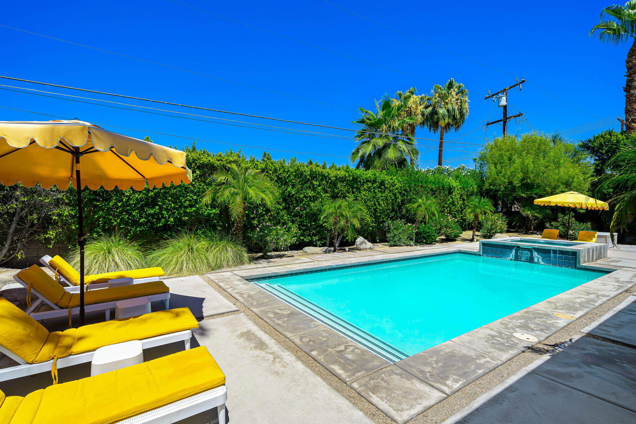 623 Desert Way Palm Springs, CA 92264 - Photo 24 of 39 a view of a swimming pool with lounge chairs