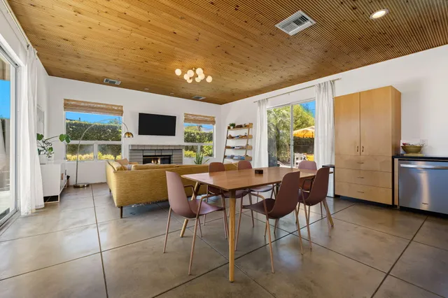 a view of a dining room with furniture window and outside view