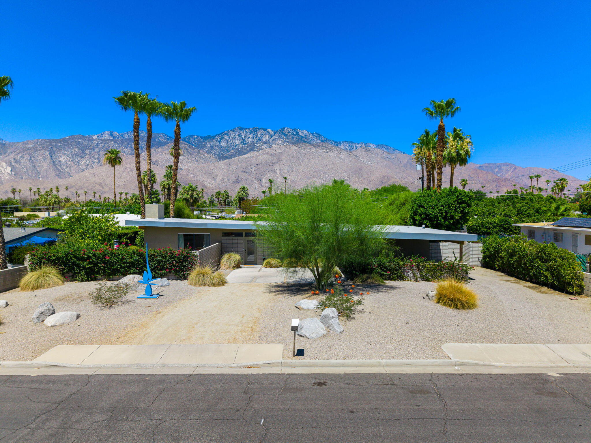 623 Desert Way Palm Springs, CA 92264 - Photo 36 of 39 a view of a bench with wooden fence