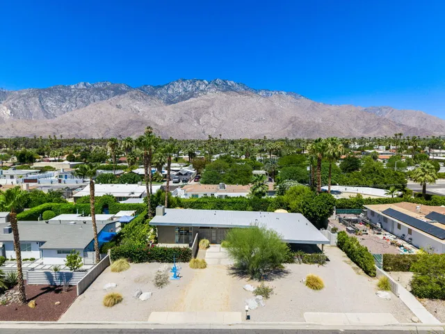 an aerial view of residential house with swimming pool