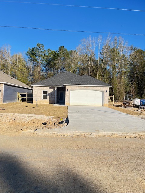 a view of a house with snow on the road