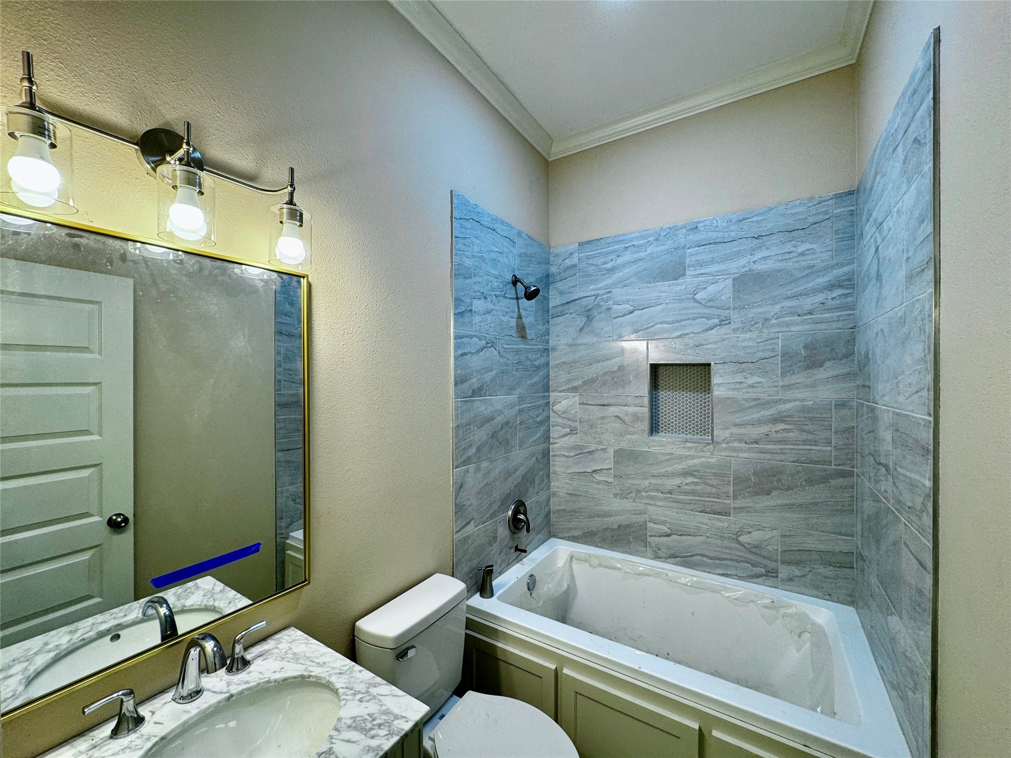 10730 Vinson Street Beaumont, TX 77713 - Photo 14 of 15 a bathroom with a sink and bathtub