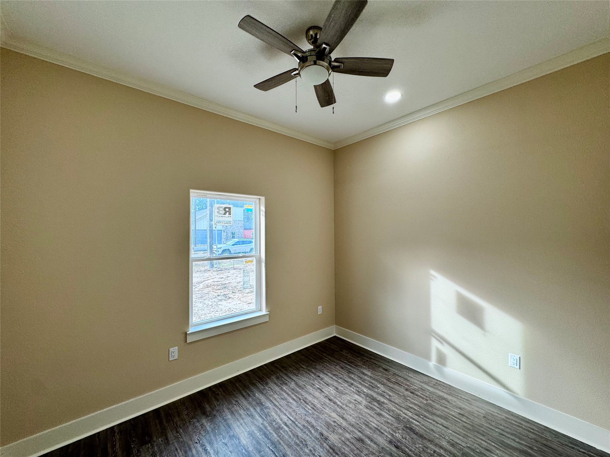10730 Vinson Street Beaumont, TX 77713 - Photo 15 of 15 a view of an empty room with window and wooden floor
