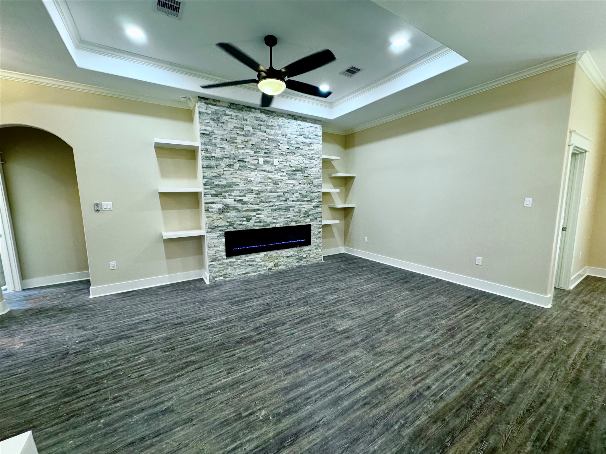 10730 Vinson Street Beaumont, TX 77713 - Photo 3 of 15 wooden floor in an empty room with a fireplace