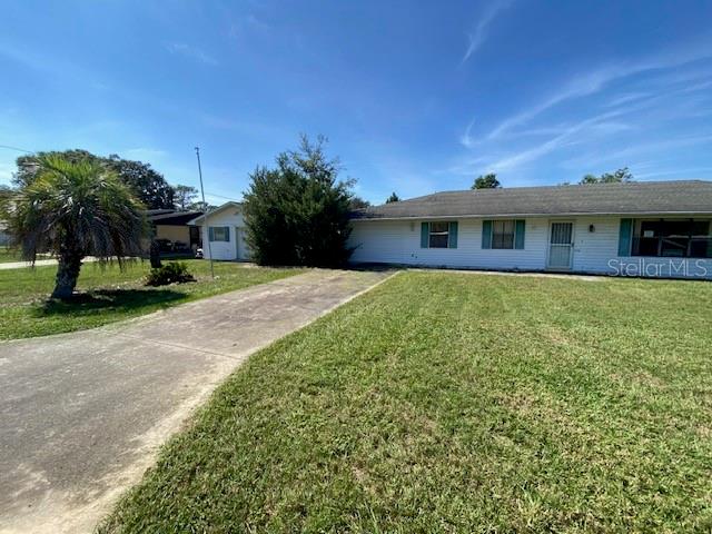 34847 Learn Road Leesburg, FL 34788 - Photo 2 of 42 a view of a house with a yard and sitting area