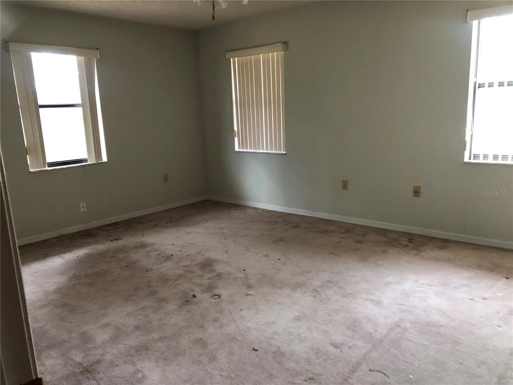 34847 Learn Road Leesburg, FL 34788 - Photo 21 of 42 an empty room with windows