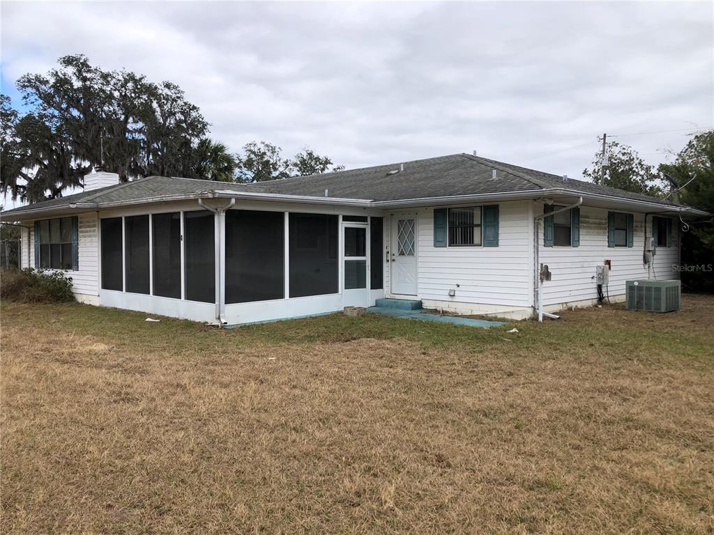 34847 Learn Road Leesburg, FL 34788 - Photo 3 of 42 a view of a house with backyard