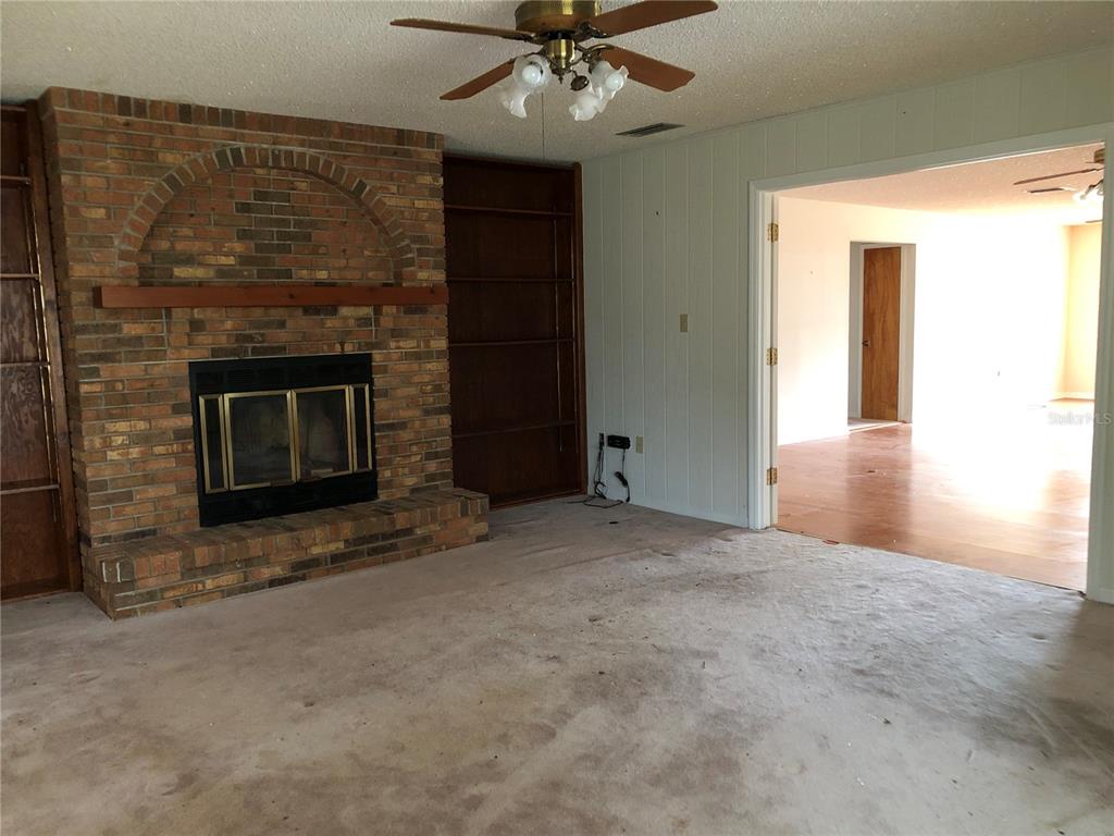 34847 Learn Road Leesburg, FL 34788 - Photo 33 of 42 a view of an empty room with a fireplace