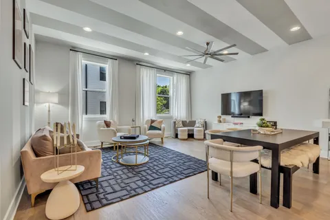 a dining room with furniture and window
